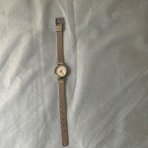 Silver watch by AccuTime watch corporation with diamond accents for each number